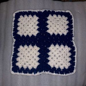 White and navy blue granny square doily